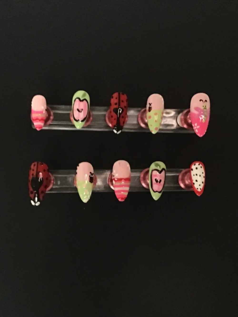 Pink, green, and red press on nail set.